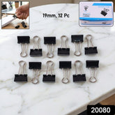 Black metal binder clips set on white background
