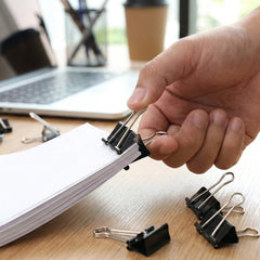 Paper binder clips holding sheets